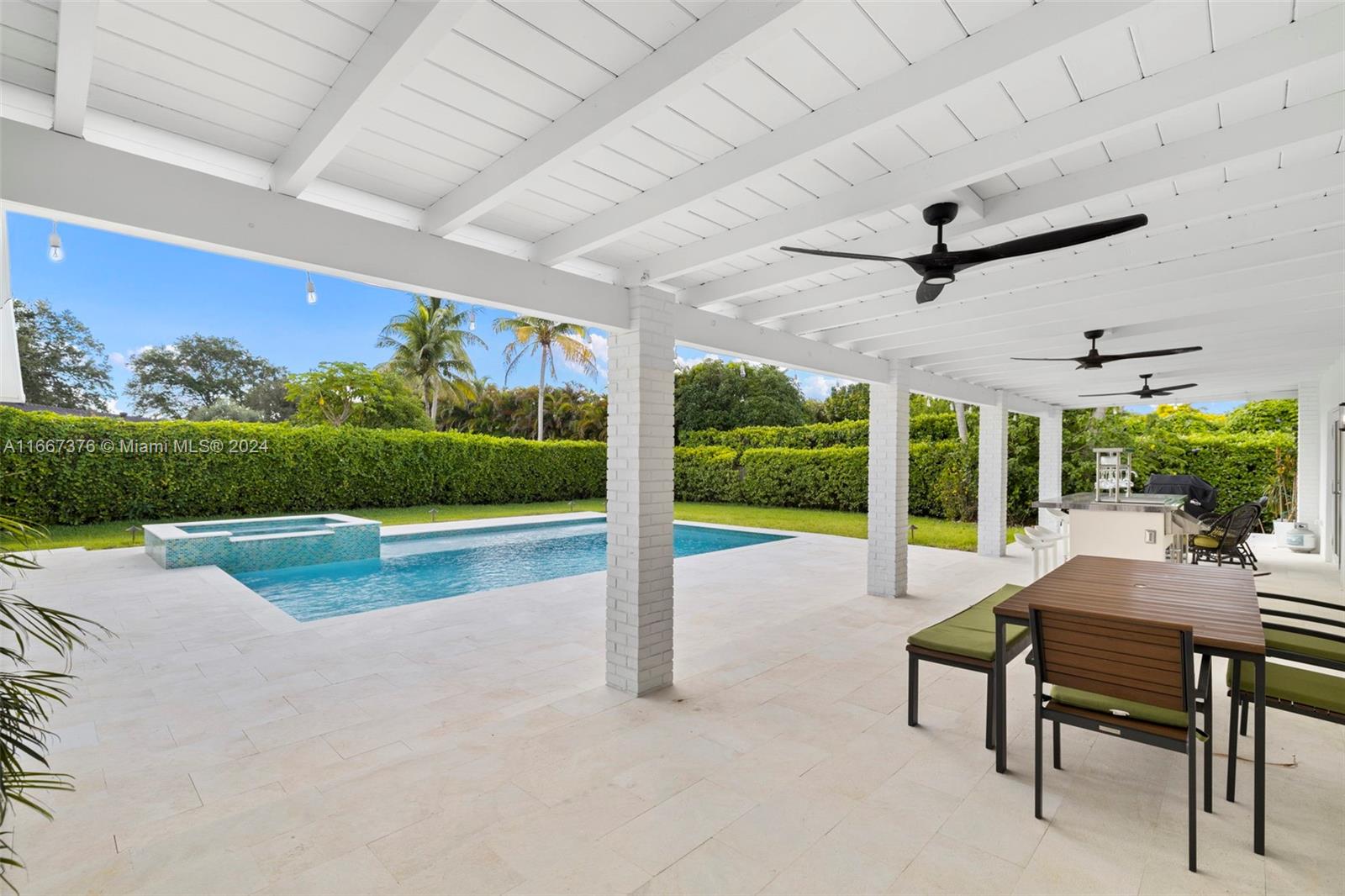 10005 Southwest 79th Avenue Miami, FL 33156 - Photo 23 of 32 a view of a patio with a table chairs and a backyard
