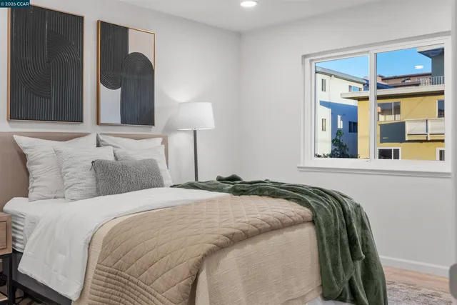 a bedroom with a bed and a lamp