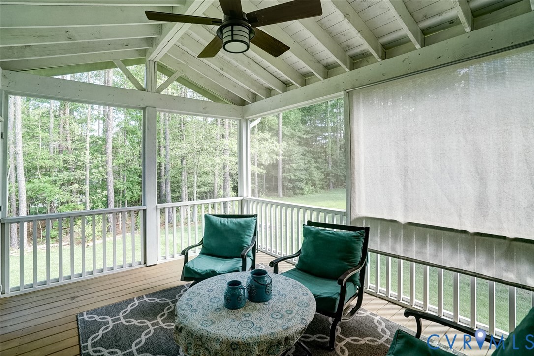 4669 Woburn Road Providence Forge, VA 23140 - Photo 37 of 78 a living room with furniture and a floor to ceiling window