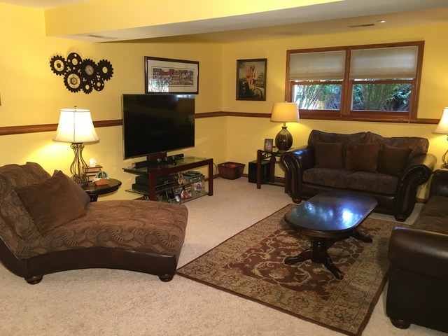 3496 Meadow Crest Circle Gurnee, IL 60031 - Photo 10 of 25 a living room with furniture and a flat screen tv