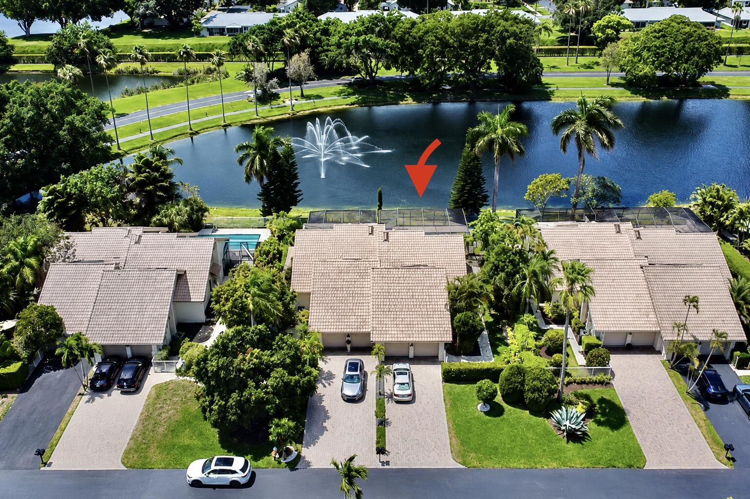 9708 Erica Court Boca Raton, FL 33496 - Photo 3 of 54 an aerial view of a house with a yard and lake view