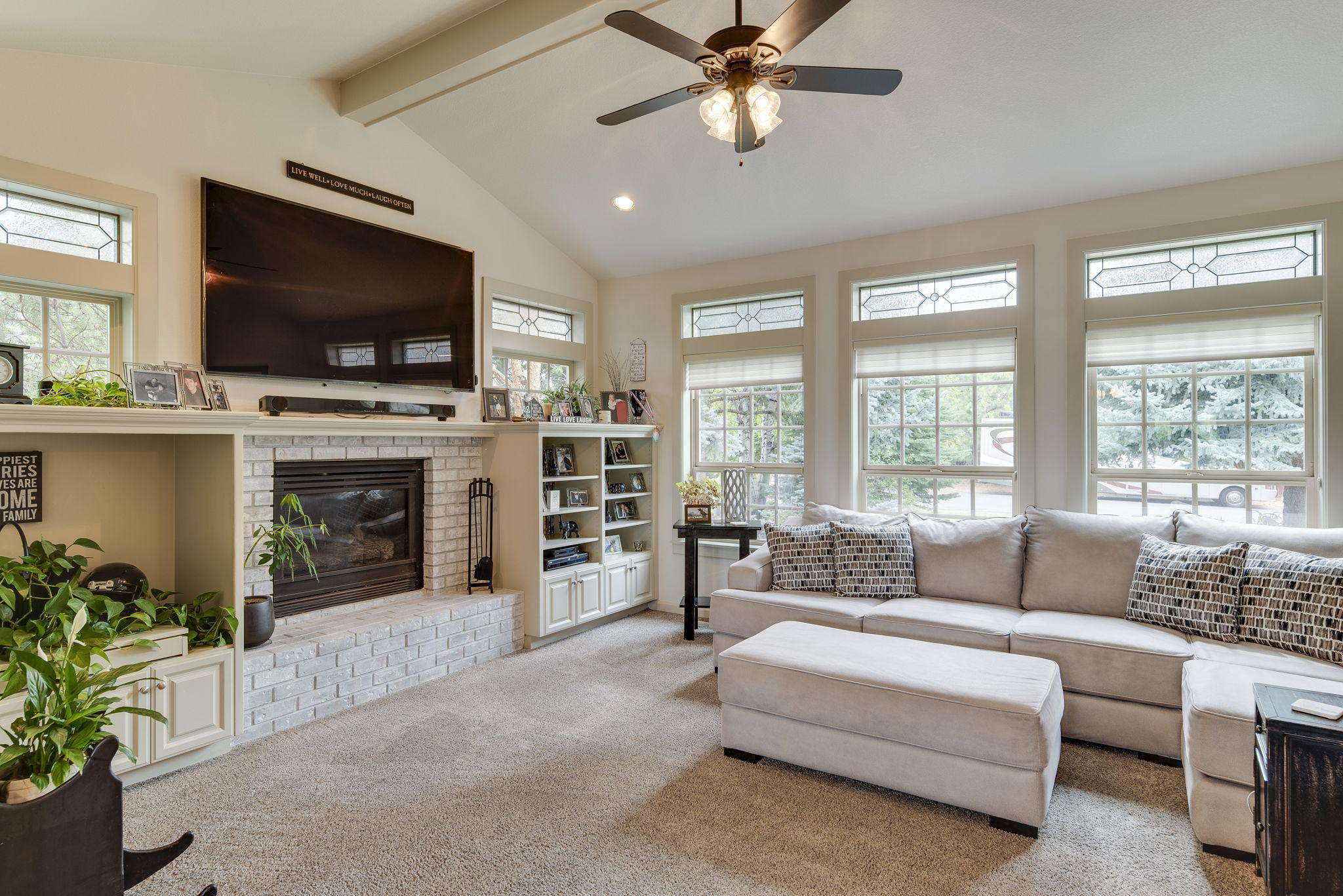 61538 Southeast Hill Ridge Road Bend, OR 97702 - Photo 11 of 59 a living room with furniture and a flat screen tv