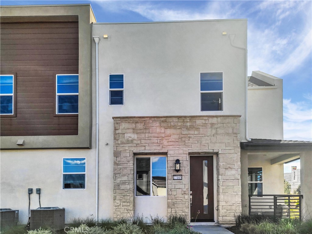 a front view of a house with stairs