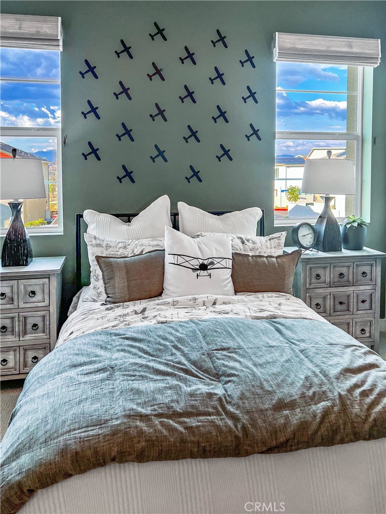 27105 Trail View Ln. Valencia, CA 91381 - Photo 23 of 30 a bedroom with a bed and window