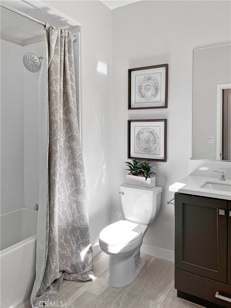 27105 Trail View Ln. Valencia, CA 91381 - Photo 8 of 30 a bathroom with a toilet a sink and a bathtub