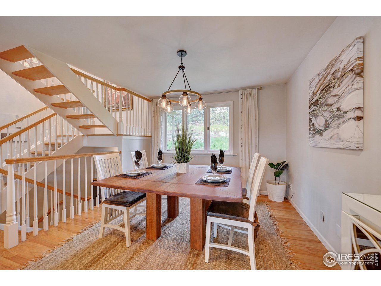 924 West Kelly Road West Boulder, CO 80302 - Photo 13 of 37 a view of a dining room with furniture and wooden floor