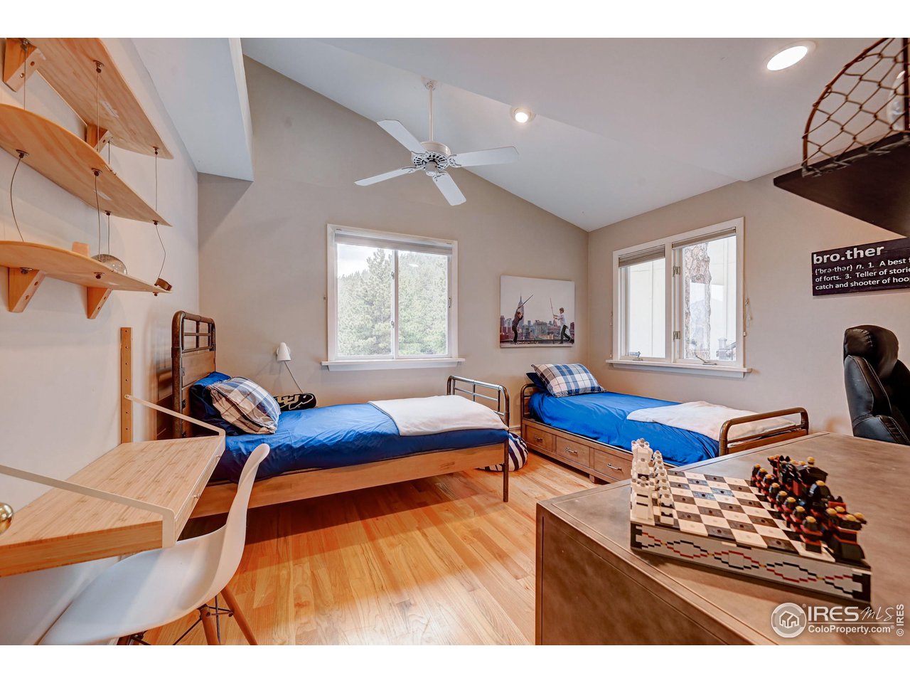 924 West Kelly Road West Boulder, CO 80302 - Photo 16 of 37 a bedroom with furniture and a window
