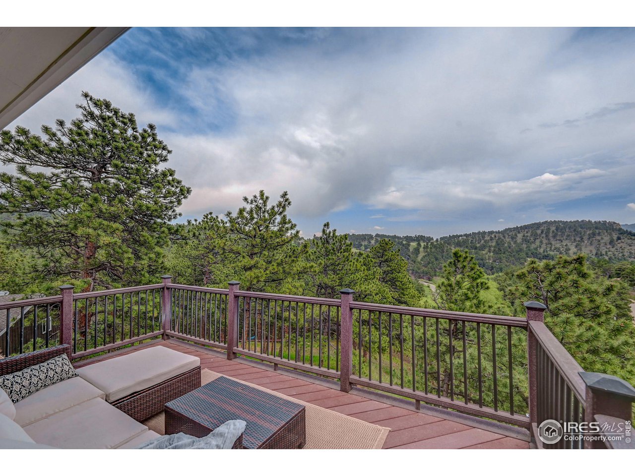 924 West Kelly Road West Boulder, CO 80302 - Photo 18 of 37 a view of a balcony with wooden floor and fence