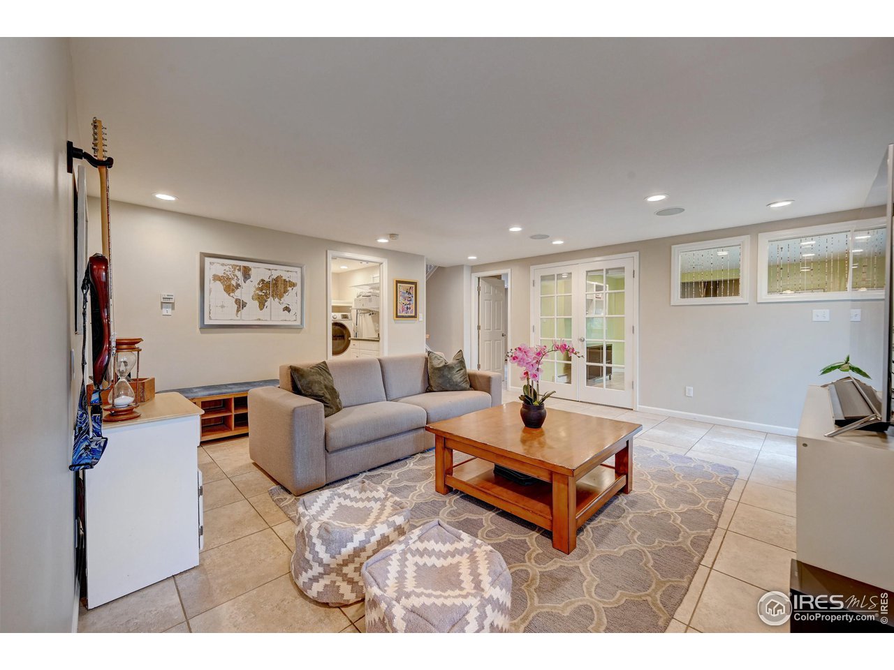 924 West Kelly Road West Boulder, CO 80302 - Photo 21 of 37 a living room with furniture a table and a flat screen tv