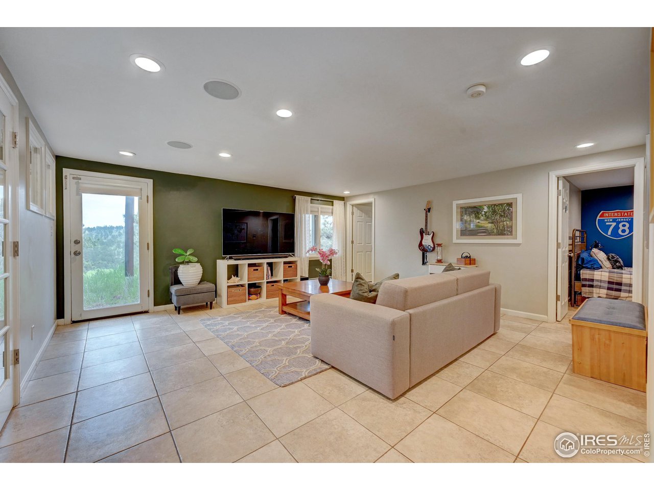 924 West Kelly Road West Boulder, CO 80302 - Photo 23 of 37 a living room with furniture and a flat screen tv