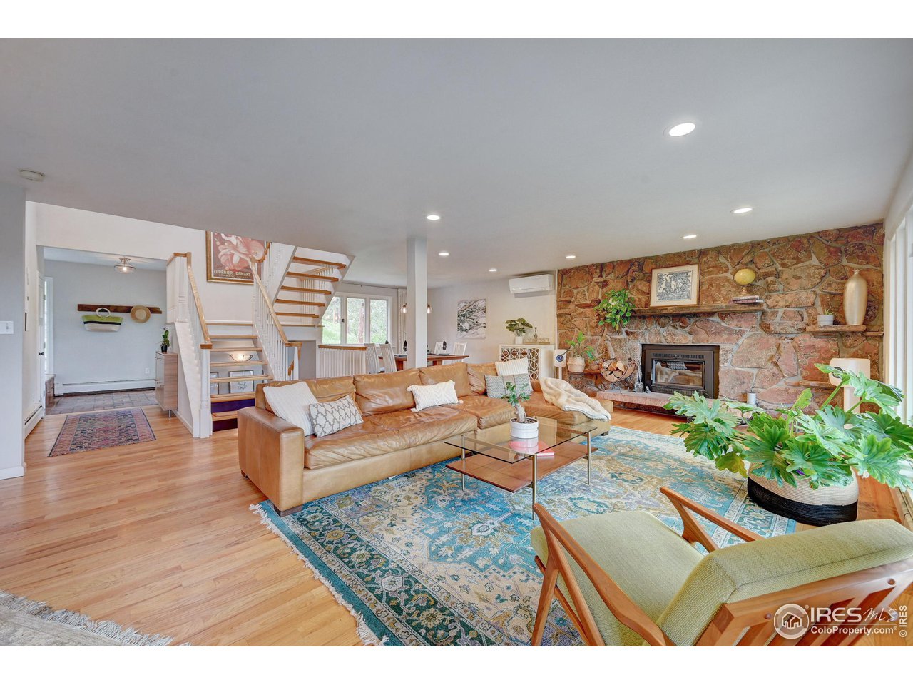924 West Kelly Road West Boulder, CO 80302 - Photo 3 of 37 a living room with fireplace furniture and a wooden floor