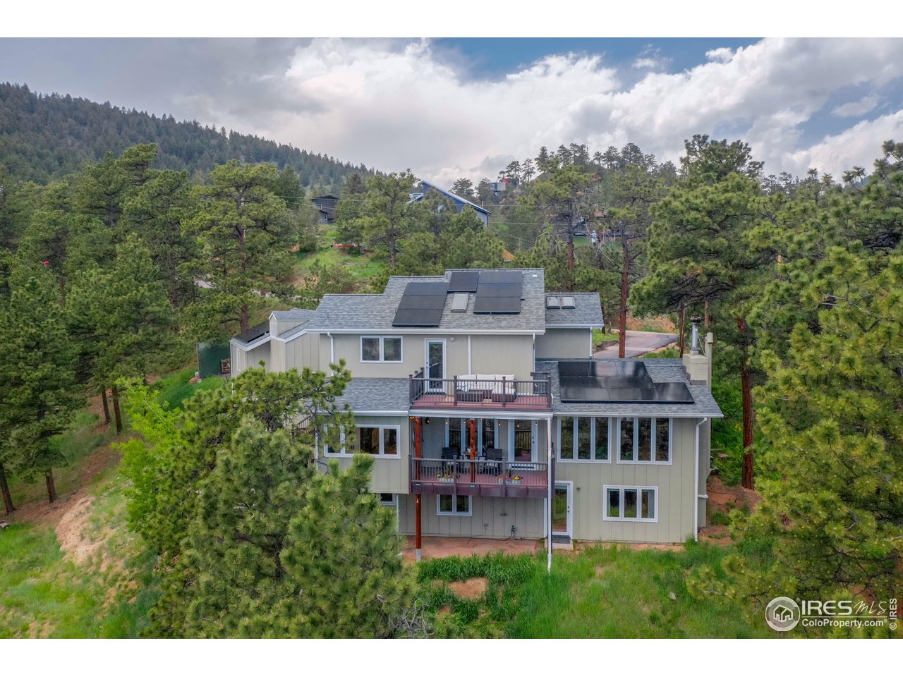 924 West Kelly Road West Boulder, CO 80302 - Photo 33 of 37 a view of a house with a garden and a mountain view