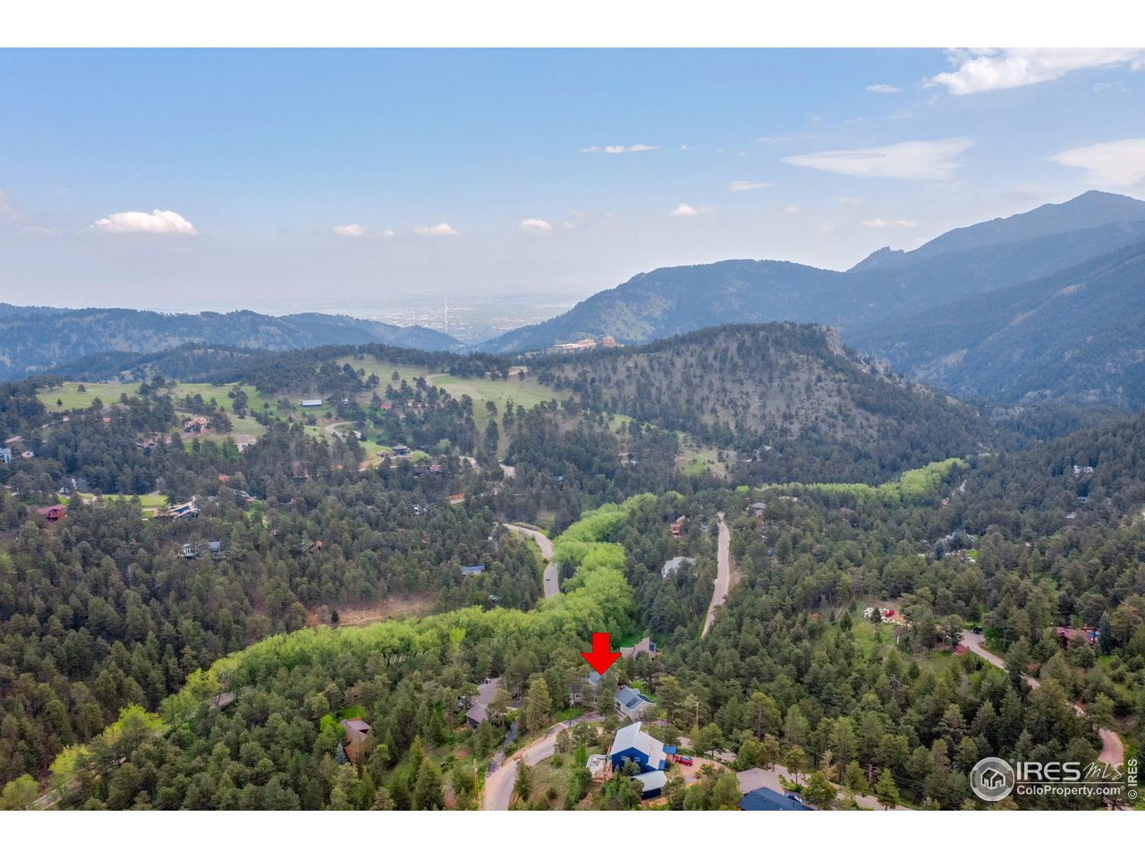 924 West Kelly Road West Boulder, CO 80302 - Photo 36 of 37 a view of a house with a yard and a large pool