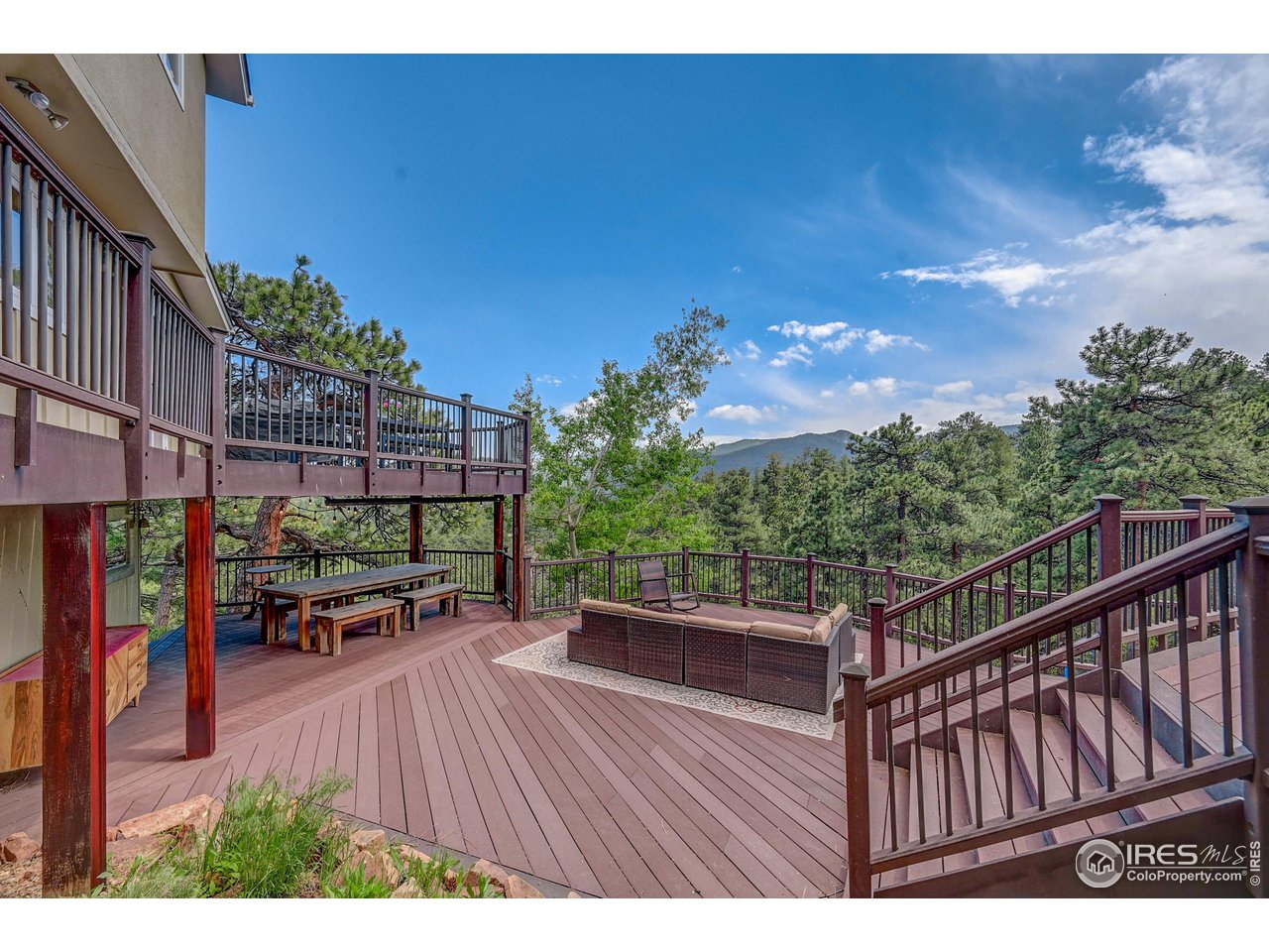 924 West Kelly Road West Boulder, CO 80302 - Photo 7 of 37 a terrace with outdoor seating and wooden floor