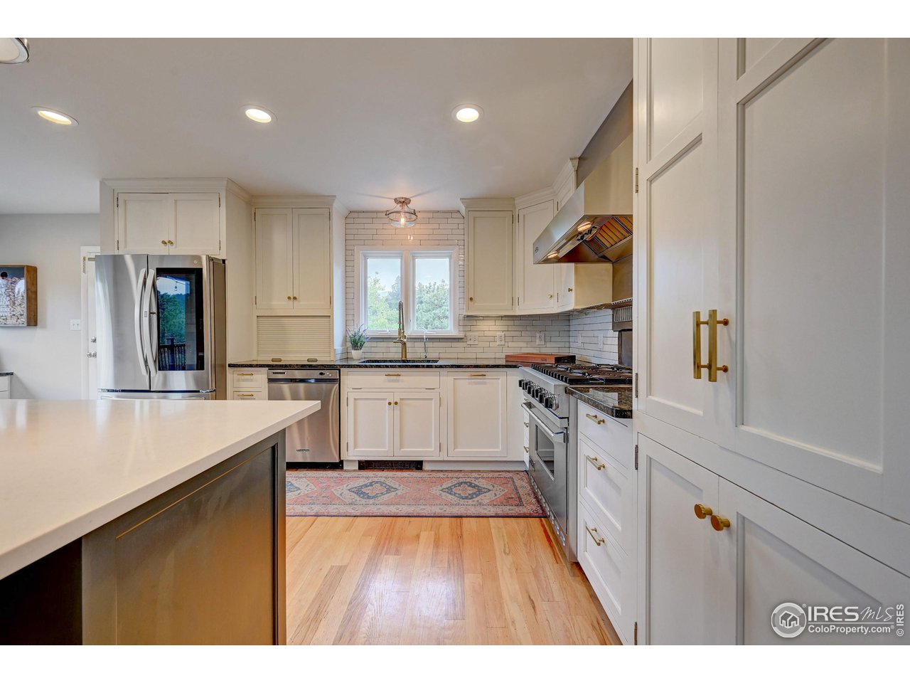 924 West Kelly Road West Boulder, CO 80302 - Photo 10 of 37 a kitchen with stainless steel appliances granite countertop a sink stove and refrigerator
