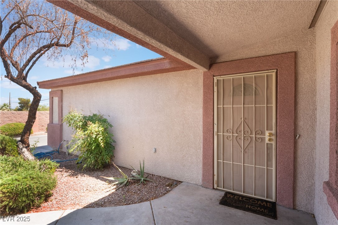 4656 East Desert Inn Road Las Vegas, NV 89121 - Photo 37 of 98 4650 E DI View of exterior entry featuring stucco siding