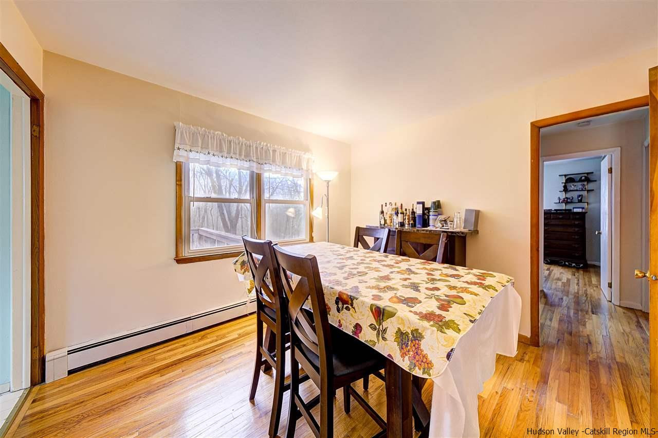 105 Gleneida Ridge Road Carmel, NY 10512 - Photo 13 of 35 a view of a dining room with furniture and wooden floor