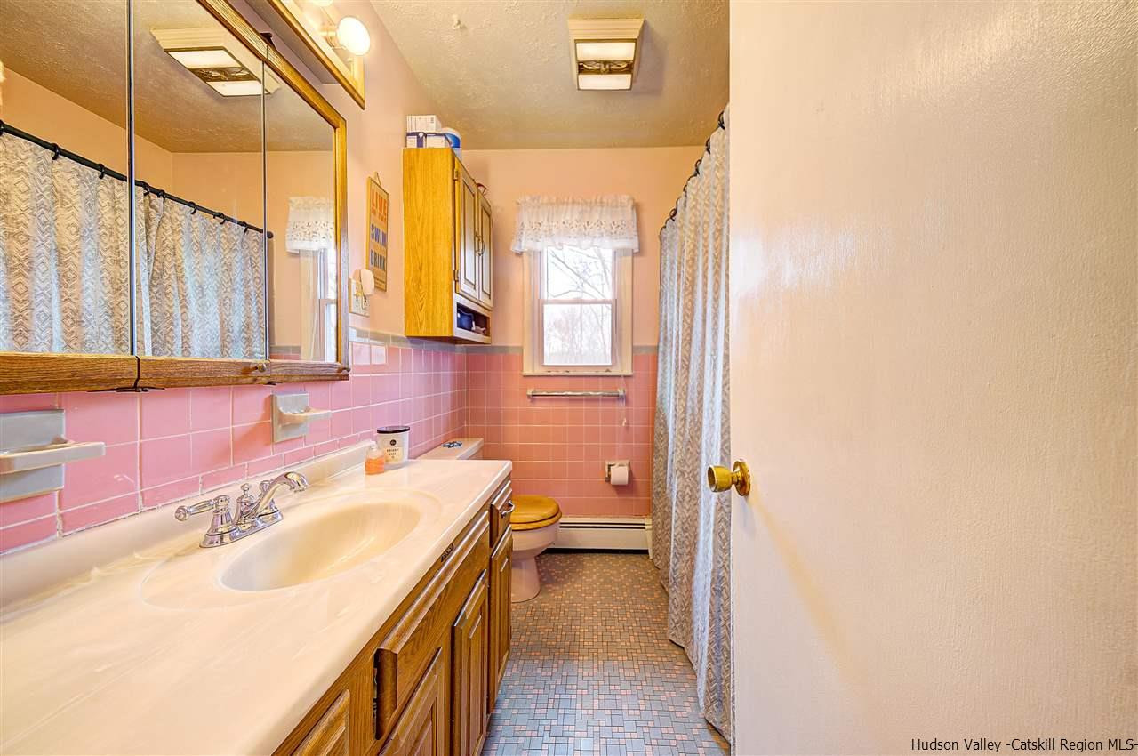 105 Gleneida Ridge Road Carmel, NY 10512 - Photo 18 of 35 a bathroom with a sink a vanity and a mirror