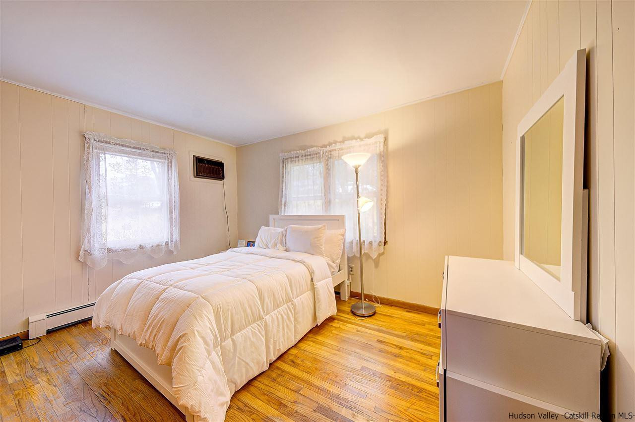 105 Gleneida Ridge Road Carmel, NY 10512 - Photo 21 of 35 a bedroom with a bed and a window