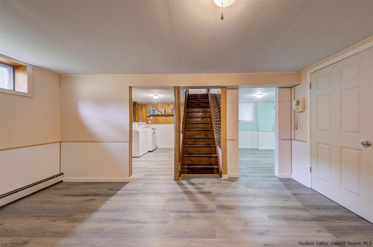 105 Gleneida Ridge Road Carmel, NY 10512 - Photo 25 of 35 an empty room with wooden floor and windows