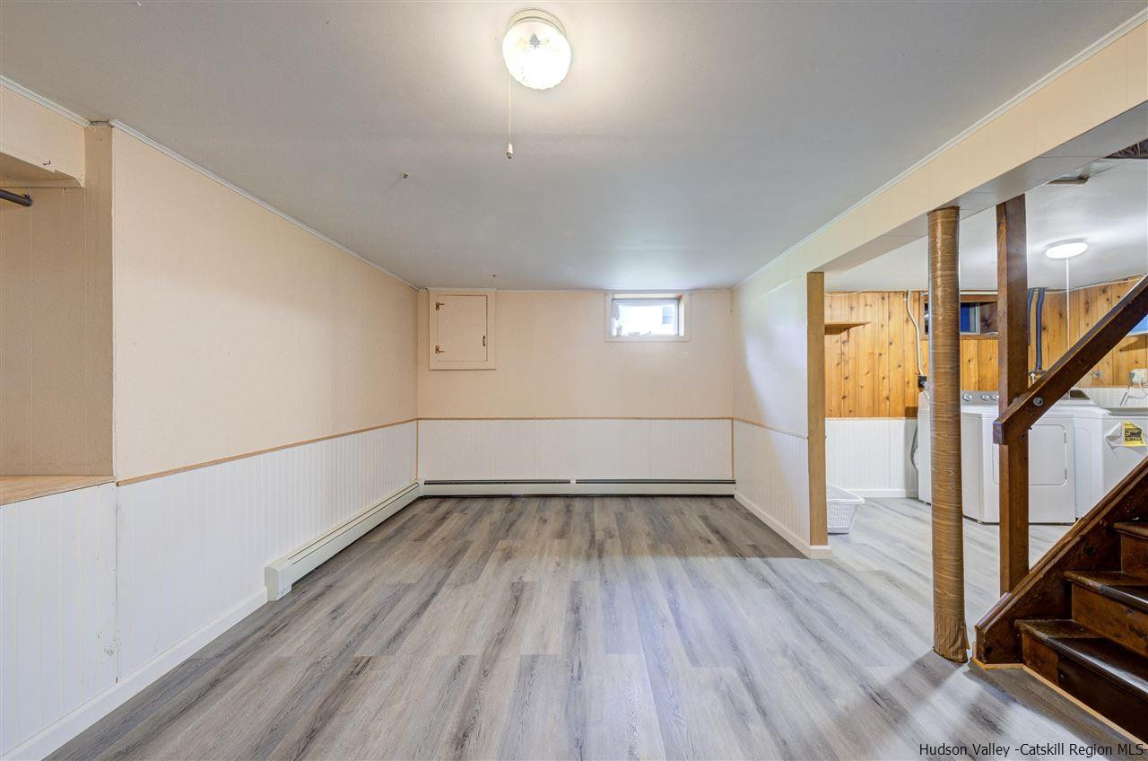 105 Gleneida Ridge Road Carmel, NY 10512 - Photo 26 of 35 an empty room with wooden floor and windows