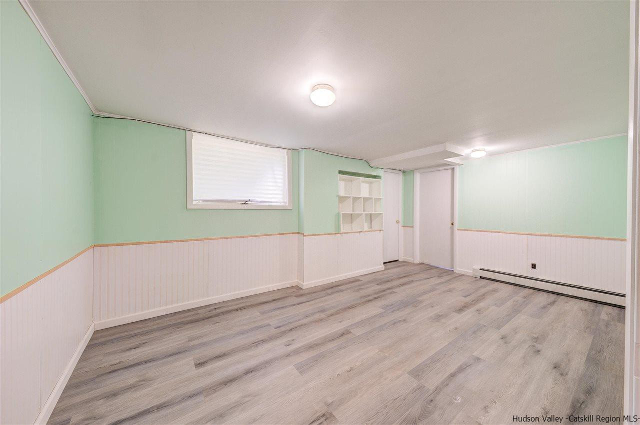 105 Gleneida Ridge Road Carmel, NY 10512 - Photo 30 of 35 an empty room with wooden floor and windows
