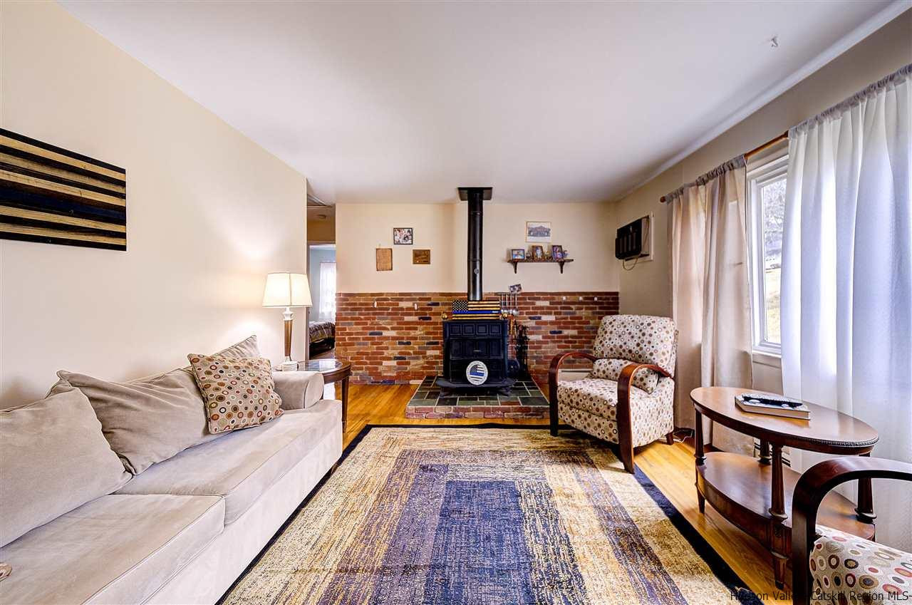 105 Gleneida Ridge Road Carmel, NY 10512 - Photo 6 of 35 a living room with furniture and a rug