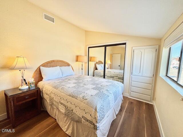 3949 Ocean Drive Oxnard, CA 93035 - Photo 18 of 24 a bedroom with a bed and a mirror