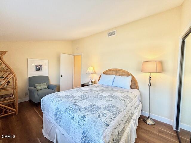 3949 Ocean Drive Oxnard, CA 93035 - Photo 19 of 24 a bedroom with a bed and a lamp