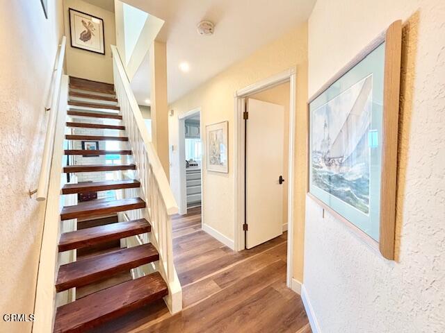 3949 Ocean Drive Oxnard, CA 93035 - Photo 23 of 24 a view of a hallway with wooden floor and windows