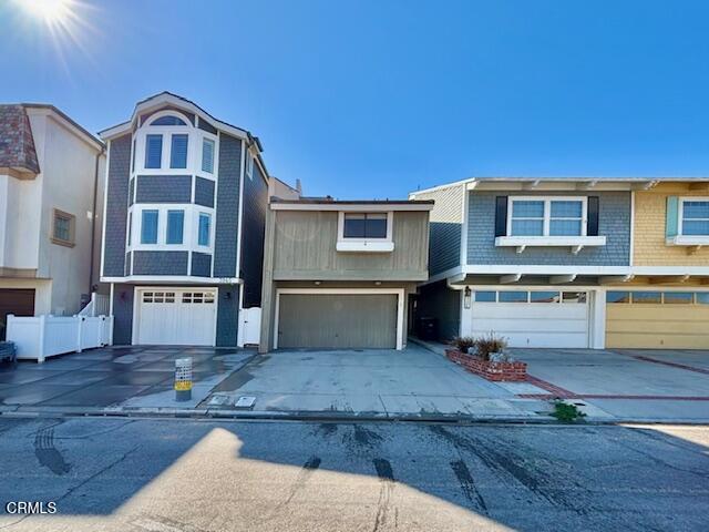 3949 Ocean Drive Oxnard, CA 93035 - Photo 3 of 24 a front view of a house with a yard