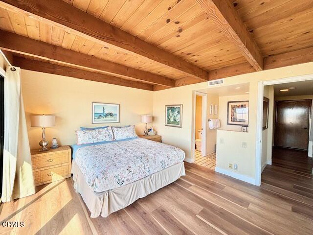 3949 Ocean Drive Oxnard, CA 93035 - Photo 6 of 24 a spacious bedroom with a bed and wooden floor