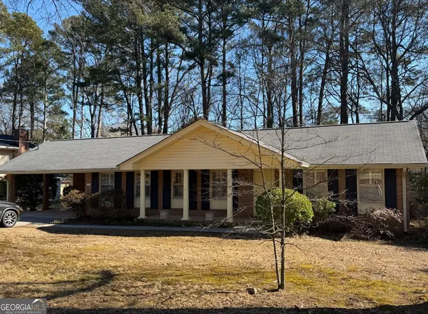 a house with trees in front of it