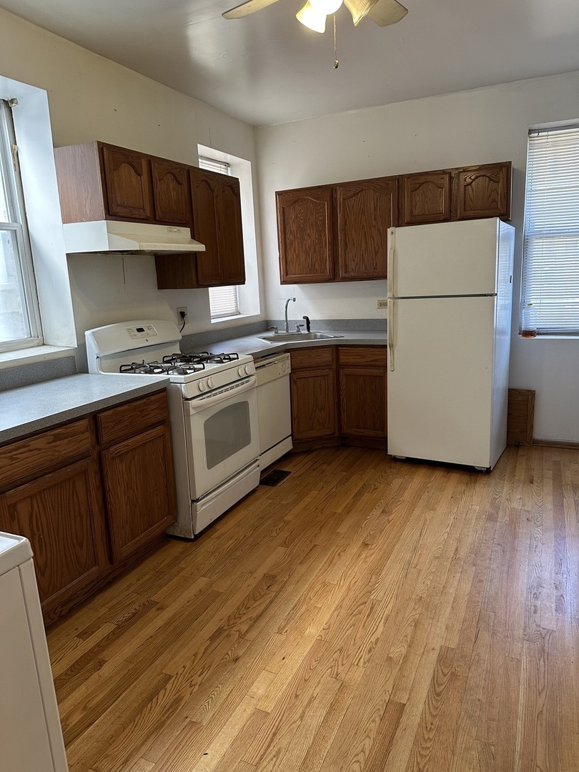 847 South Miller Street Chicago, IL 60607 - Photo 2 of 8 a kitchen with a cabinets and wooden floor