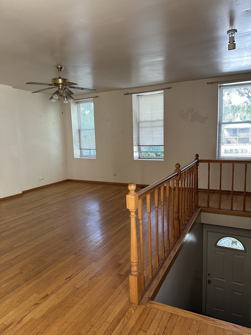 847 South Miller Street Chicago, IL 60607 - Photo 7 of 8 wooden floor in an empty room with a window