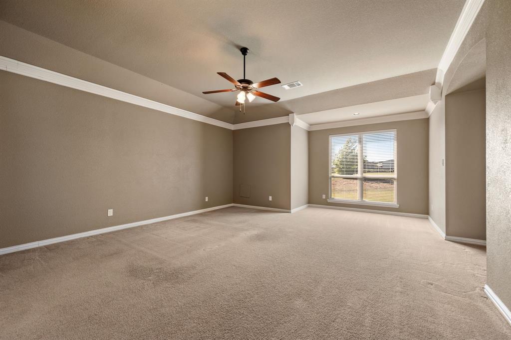 282 Heather Lane Decatur, TX 76234 - Photo 15 of 36 a view of an empty room with a ceiling fan and window
