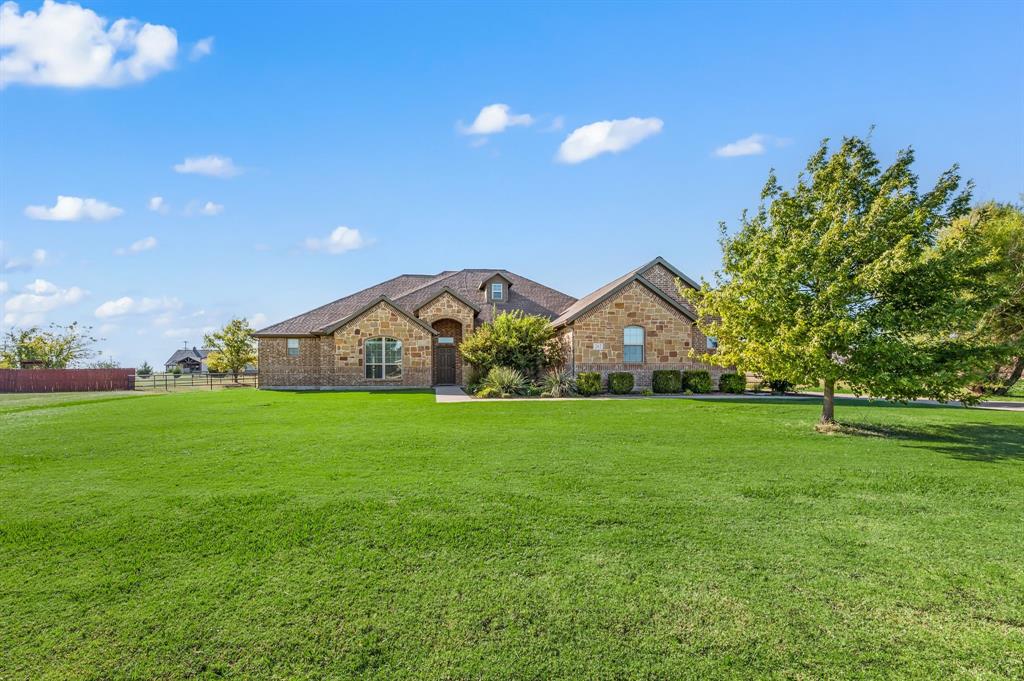 282 Heather Lane Decatur, TX 76234 - Photo 3 of 36 a view of an house with a big yard and a large tree