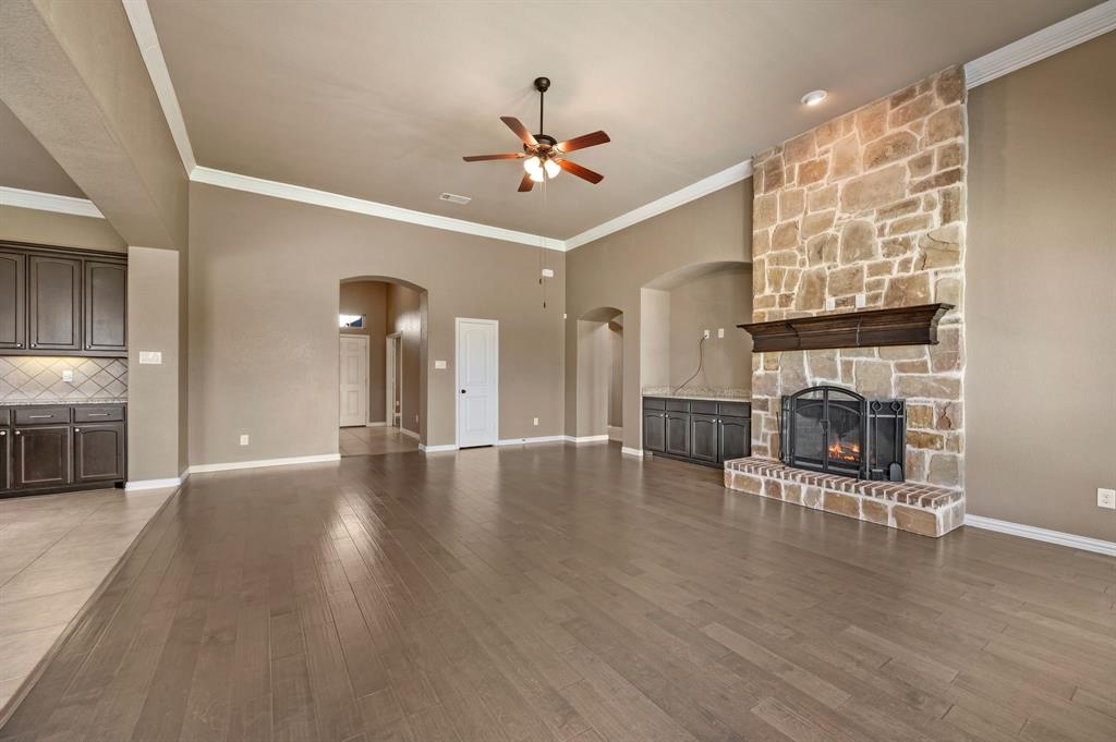 282 Heather Lane Decatur, TX 76234 - Photo 6 of 36 a view of a livingroom with fireplace wooden floor and windows