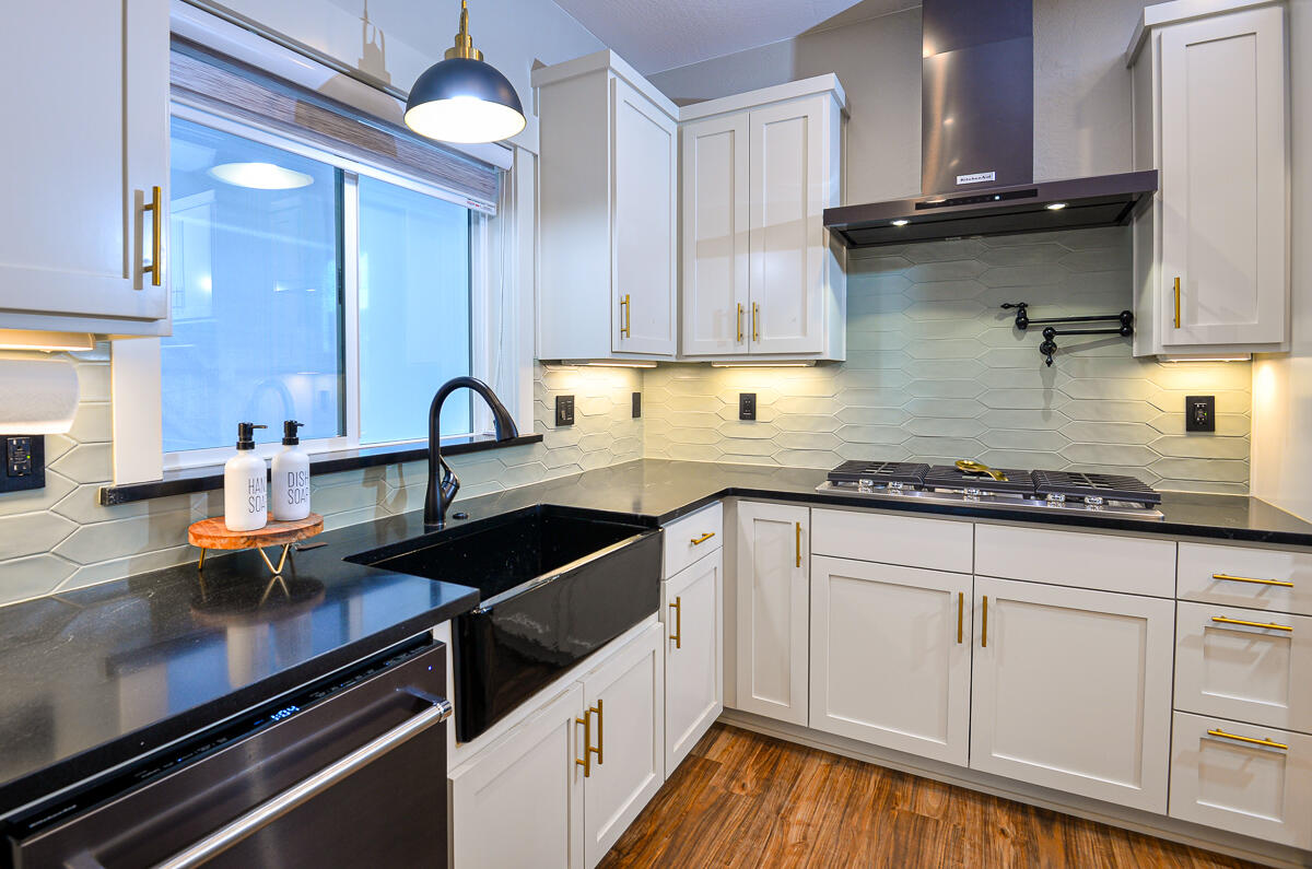 1029 Brandon Way Phoenix, OR 97535 - Photo 12 of 75 a kitchen with granite countertop a sink stainless steel appliances and cabinets