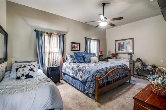 a spacious bedroom with a bed and window