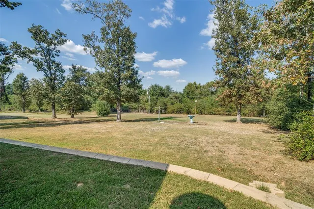 a view of a playground with basketball court
