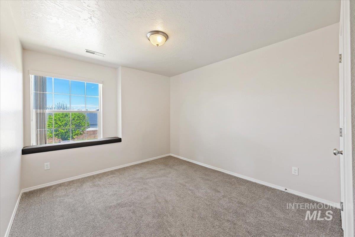 1555 Condor Drive Middleton, ID 83644 - Photo 23 of 50 Room featuring a large window with white muntins and a dark sill