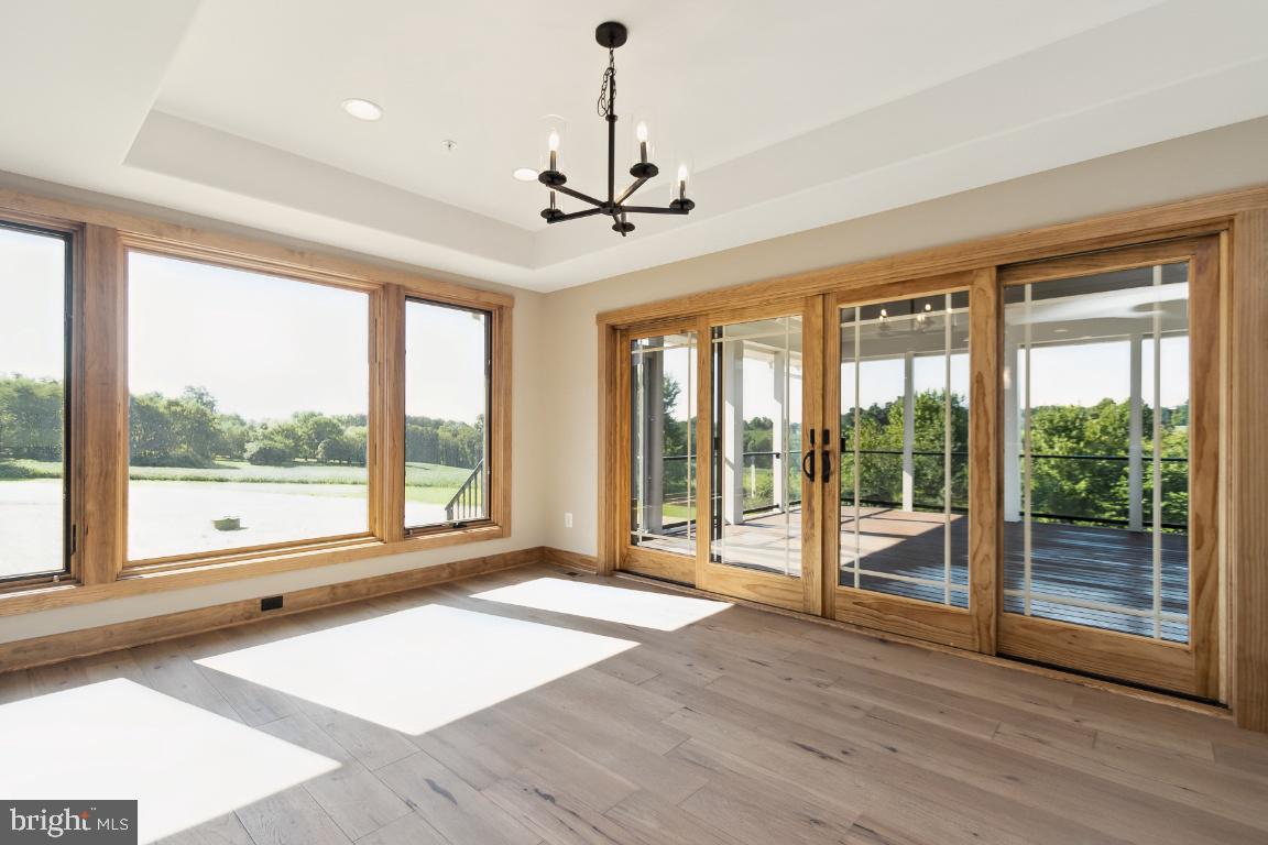 2075 Coon Club Road Westminster, MD 21157 - Photo 6 of 43 Dining room off of kitchen opens to covered deck.