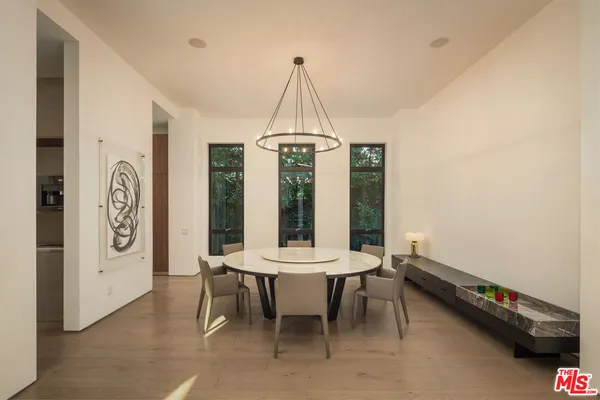 a dining room with a table and chairs