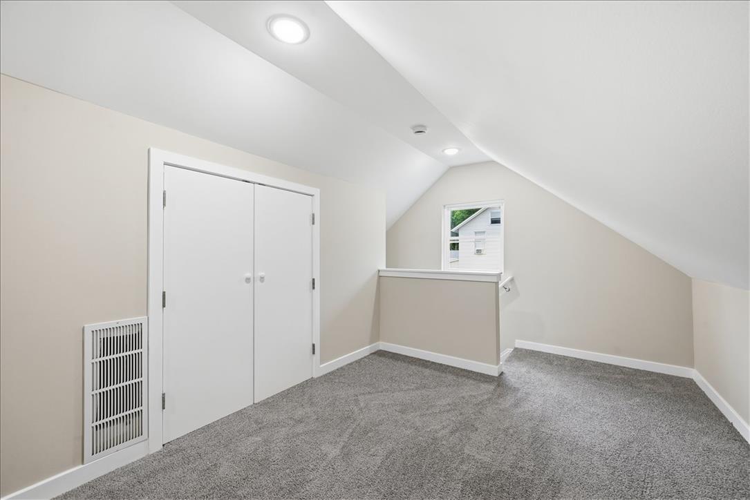 5641 North Coplay Road Whitehall, PA 18052 - Photo 46 of 68 A versatile loft space, carpeted and well-lit, offers additional living area with a bright window.