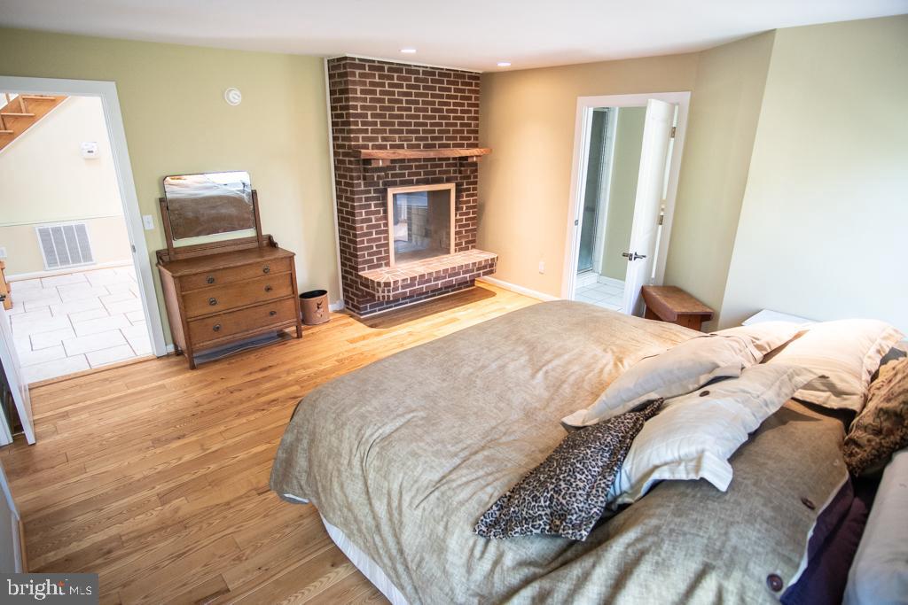 13316 Berkeley Road Orange, VA 22960 - Photo 9 of 44 master with brick dual fireplace