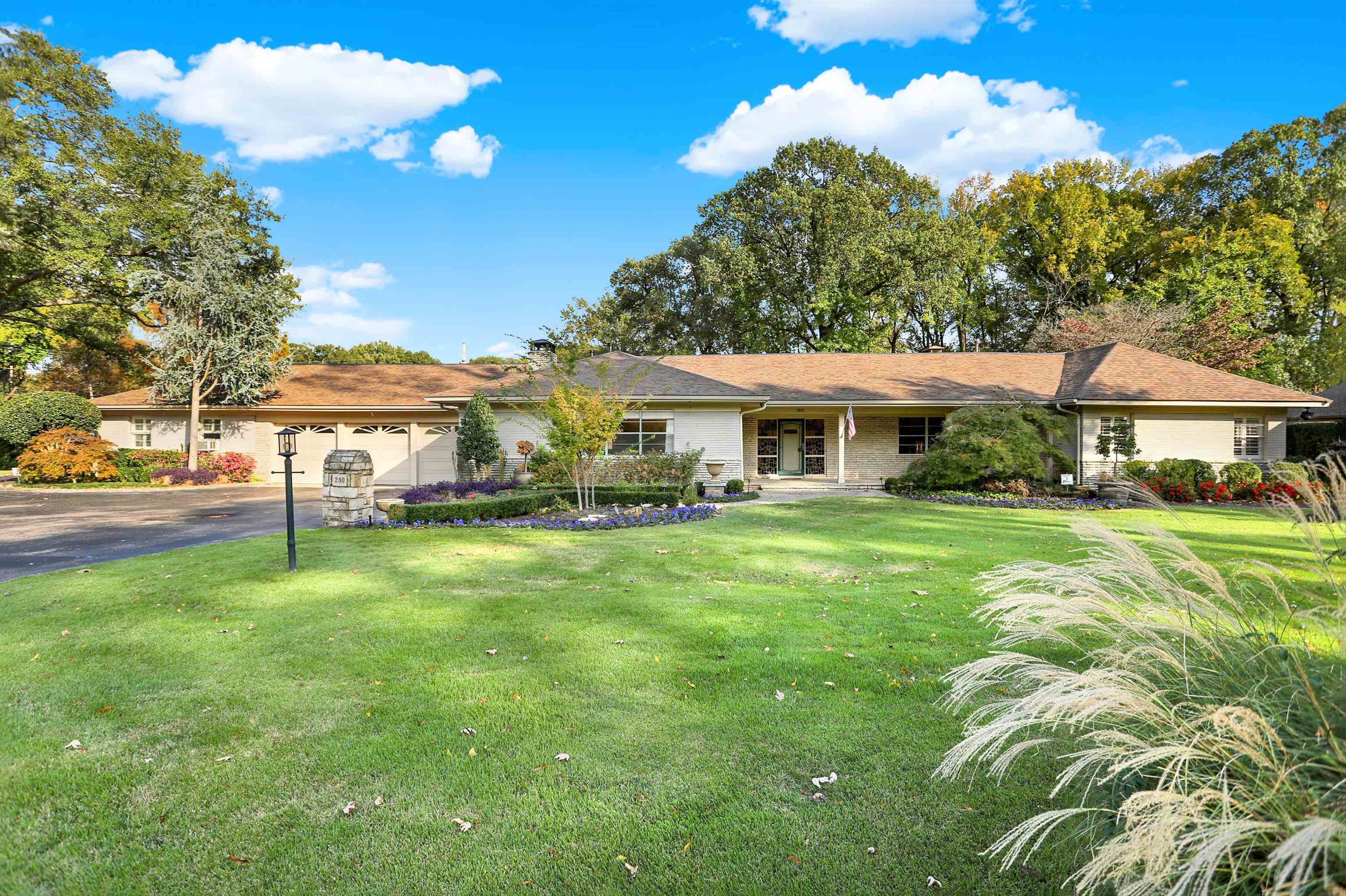 a front view of house with yard and outdoor seating