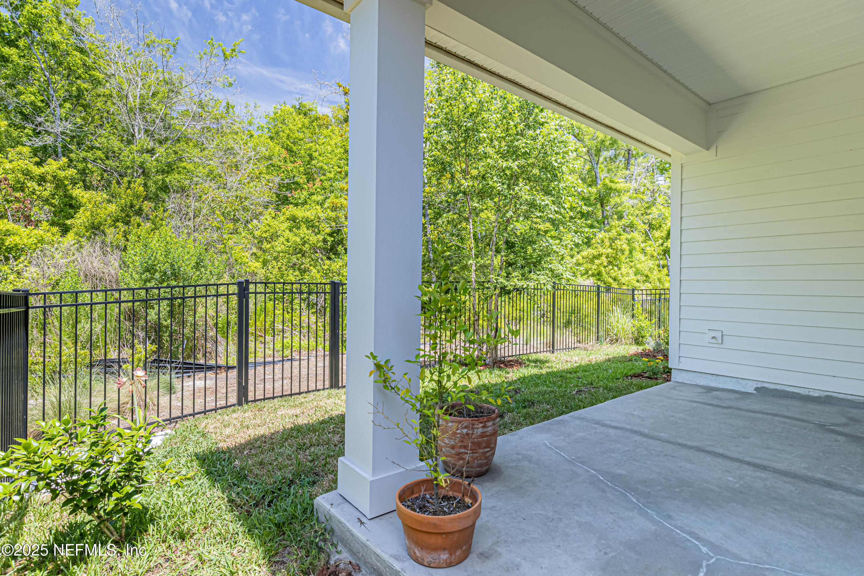 383 Windswept Way Street St. Augustine, FL 32092 - Photo 33 of 34 a garden view with a fountain