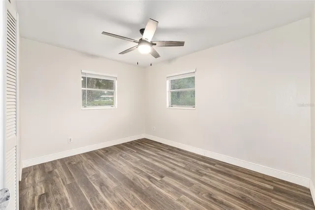 a bathroom with a toilet a sink and a mirror