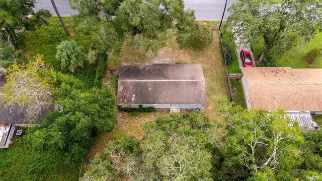 a kitchen with stainless steel appliances granite countertop a sink and a refrigerator